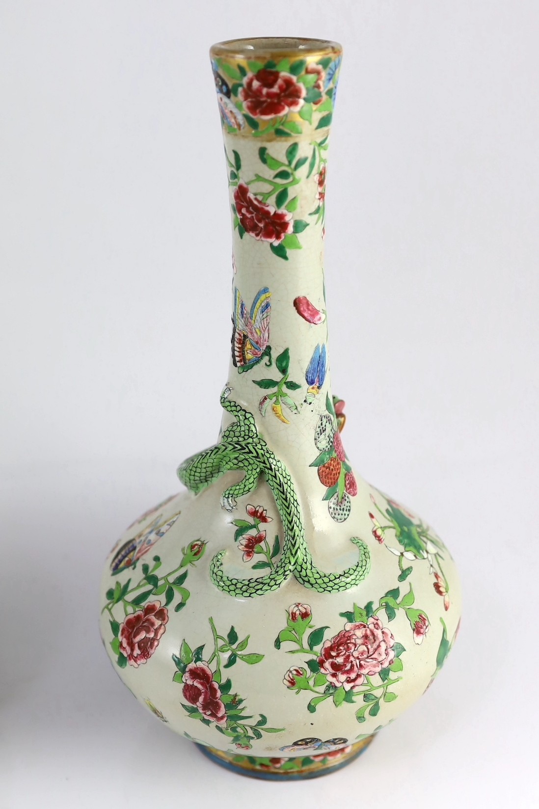 A pair of Chinese enamelled porcelain crackle glaze bottle vases, mid 19th century, 33cm high, chips to feet